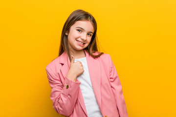 Fototapeta premium Little caucasian cute girl smiling and raising thumb up