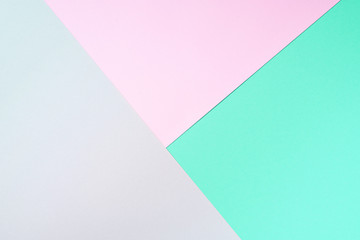 Colorful trendy green and pink paper background. Top view. Copy space