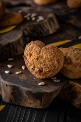Biscuit with berry or fruit filling. Crispy and crumbly delicious cookies with natural ingredients: flour, nuts, seeds, pieces of chocolate, cocoa, fruit jams.   Stylish still life for poster.