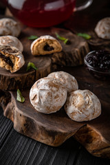 Crispy and crumbly delicious cookies  Gingerbread with natural ingredients: flour, nuts, seeds, pieces of chocolate, cocoa, fruit jams. Stylish still life for poster.