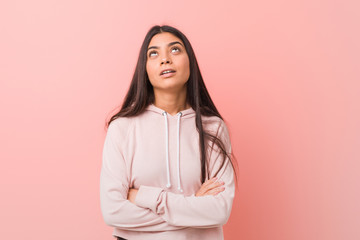 Fototapeta premium Young pretty arab woman wearing a casual sport look tired of a repetitive task.