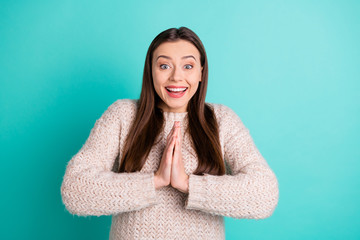 Fototapeta premium Photo of cheerful charming cute pretty nice glad girlfriend begging someone wearing jumper while isolated with turquoise vibrant color background