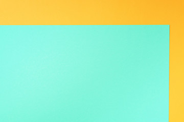 Colorful trendy green and yellow paper background. Top view. Copy space
