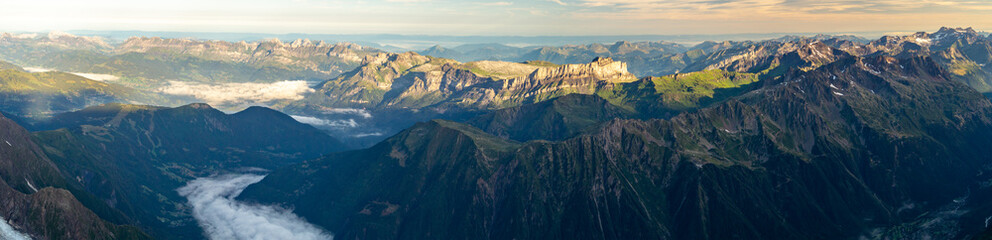 Fototapeta na wymiar Panorama of mountain range at down. French Alps