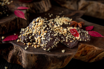 Chocolate biscuit. Crispy and crumbly delicious cookies with natural ingredients: flour, nuts, seeds, pieces of chocolate, cocoa, fruit jams. Beautiful wallpaper. Stylish still life for poster.