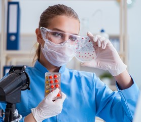 Female scientist researcher conducting an experiment in a labora