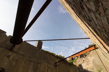 Creative view from inside the derelict crushing house at the abandoned Porth Wen Brickworks, Isle...