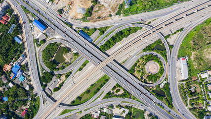 Rail track and conductor rail  top view, Road Expressway traffic an important infrastructure with moving cars and railway tracks on which the train rides in Bangkok Thailand.