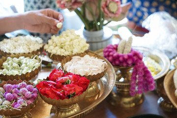flower garland. The making of beautiful flower garland is a culture of Thailand. Soft focus on the rose petal.