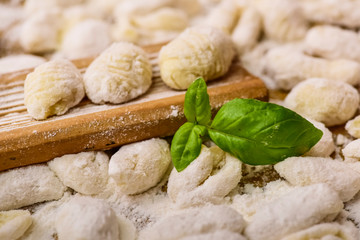 Cook homemade gnocchi on the table, Italian tradition
