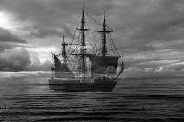Retro sailing ship on sea and dramatic sky