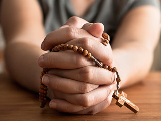 hands with rosary
