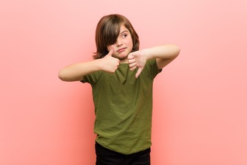 Little boy showing thumbs up and thumbs down, difficult choose concept