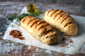 Homemade Italian bread with herbs and spices. Selective focus. Macro.