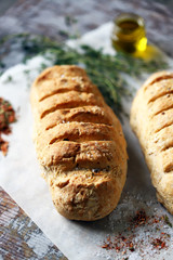 Homemade Italian bread with herbs and spices. Selective focus. Macro.