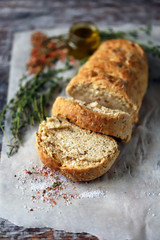 Homemade Italian bread with herbs and spices. Selective focus. Macro.