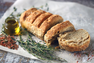 Homemade Italian bread with herbs and spices. Selective focus. Macro.