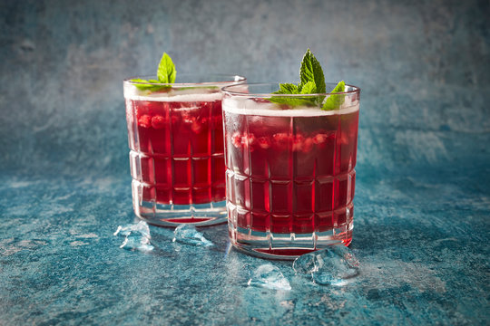Elderberry cordial with ice and mint in glass close up