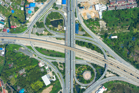 Rail track and conductor rail  top view, Road Expressway traffic an important infrastructure with moving cars and railway tracks on which the train rides in Bangkok Thailand.