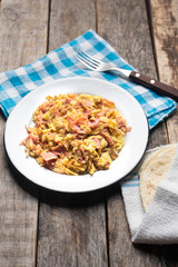Tradtional scrambled eggs with ham breakfast