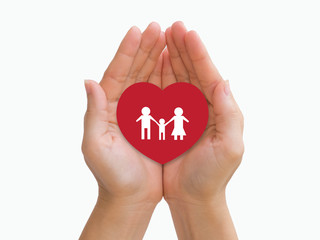 Family in a red heart on hands