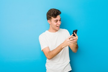 Teenager caucasian man talking on the phone