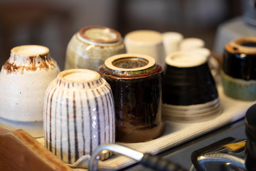 Step by step coffee making part nine. Cups are stored and heated above the coffee maching