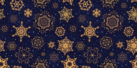 Golden snowflakes on dark blue background seamless pattern. Snowfall on a magical Christmas night. Winter backdrop. Vector illustration.