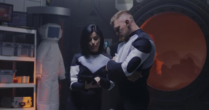 Astronauts working in a Mars base