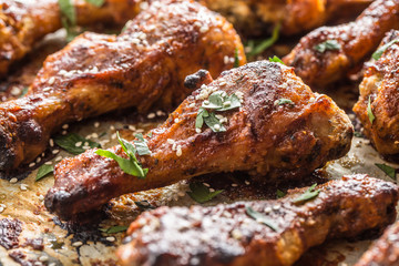 Roasted chicken legs barbecue on baked paper - Close-up