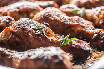 Roasted chicken legs barbecue on baked paper - Close-up