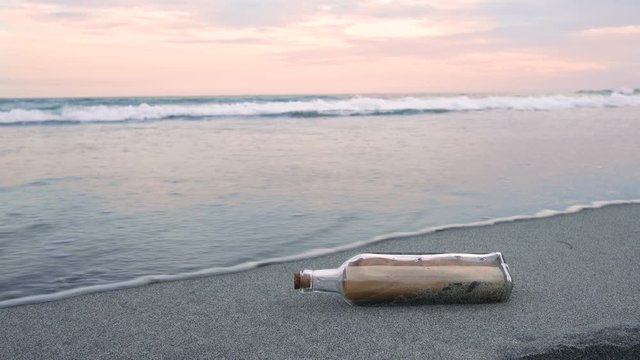 An image of a letter in a bottle drifting on the twilight beach., bottle,
