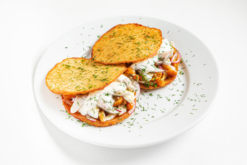potato pancakes with herring, and onion