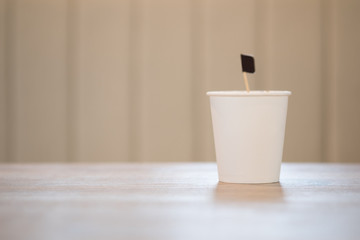 White disposable paper cup