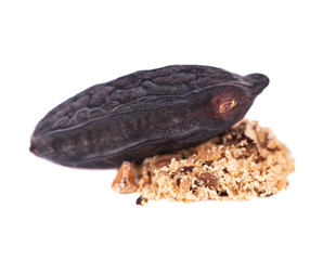 Tonka beans isolated on white background. Bean of Dipteryx odorata, cumaru or kumaru. Fresh aroma tonka bean powder. Close-up.