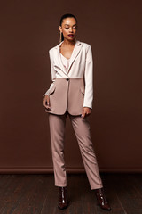 Sexy beautiful woman fashion glamour model brunette hair makeup wear suit trousers jacket clothes...