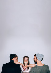 Polygamy lifestyle. Gender equality acceptance. Happy confident woman with two men.