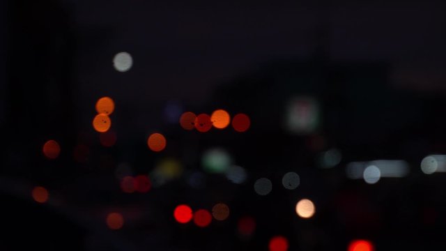 Abstract bokeh lights, Headlights of moving cars urban traffic.