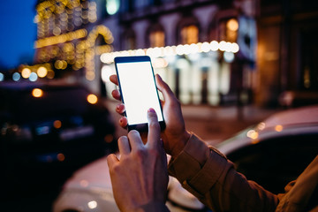 Close-up woman uses a mobile phone