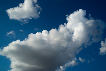 White color clouds found in the blue sky background