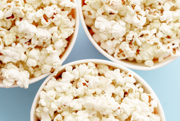 Popcorn in buckets. Three buckets with popcorn, top view.