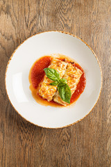 tasty lasagna with tomato sauce