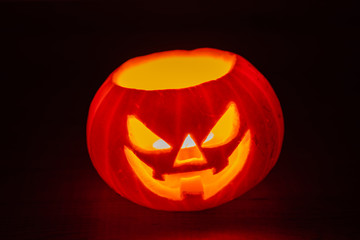 Glowing Halloween pumpkins isolated on dark background, Jack o lantern