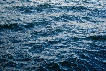 Waves on transparent water surface