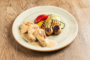 meat with grilled vegetables on the wooden background