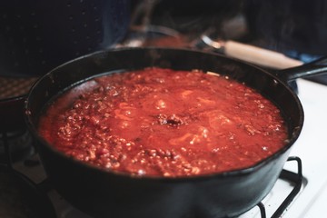 cooking sauce in cast iron