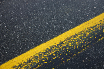 yellow lines on the road, traffic information signs on asphalt,