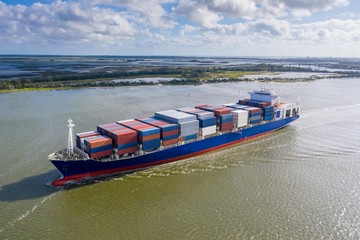 Large container ship entering port in Jacksonville, FL.