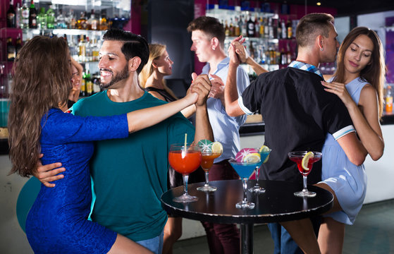 Couple dancing tango in bar