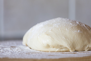 dough on table with flour
